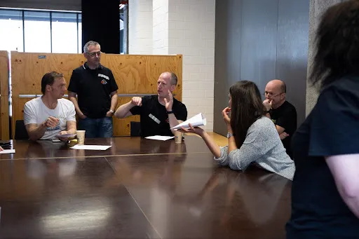 Group discussing about puzzle pieces