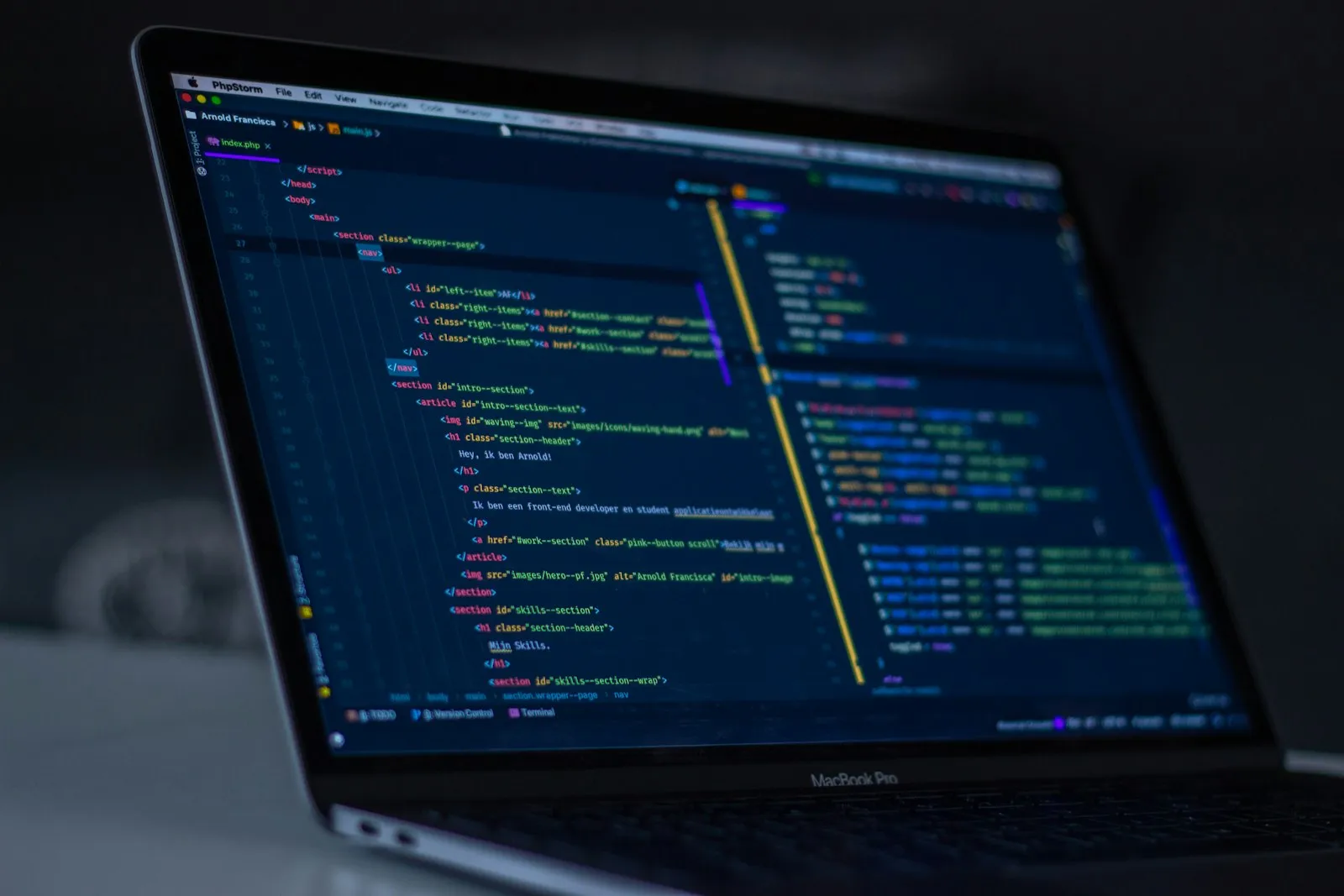 A laptop showing source code